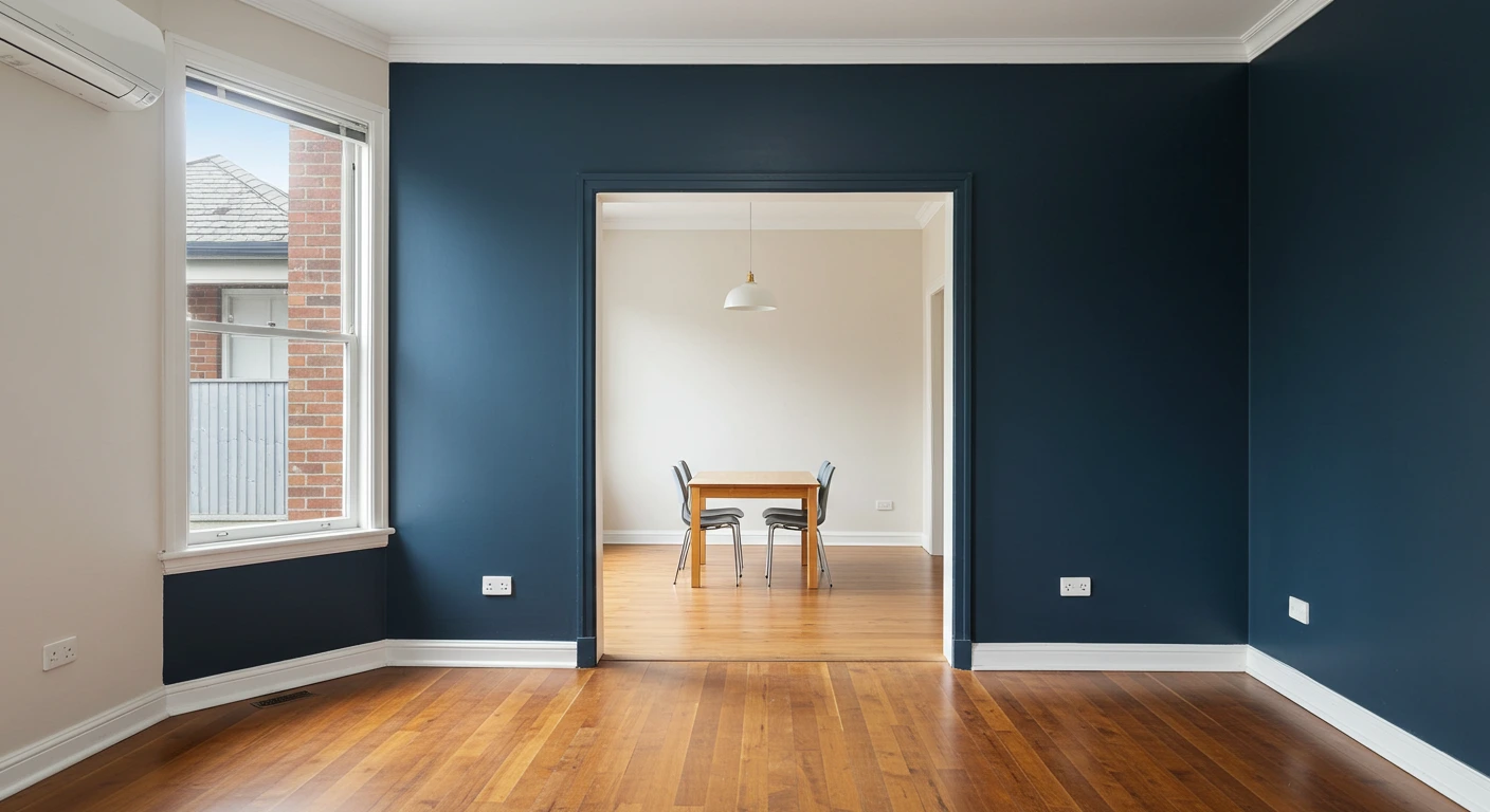 Cosy living room with navy accent wall and warm neutral fireplace – premium interior painting